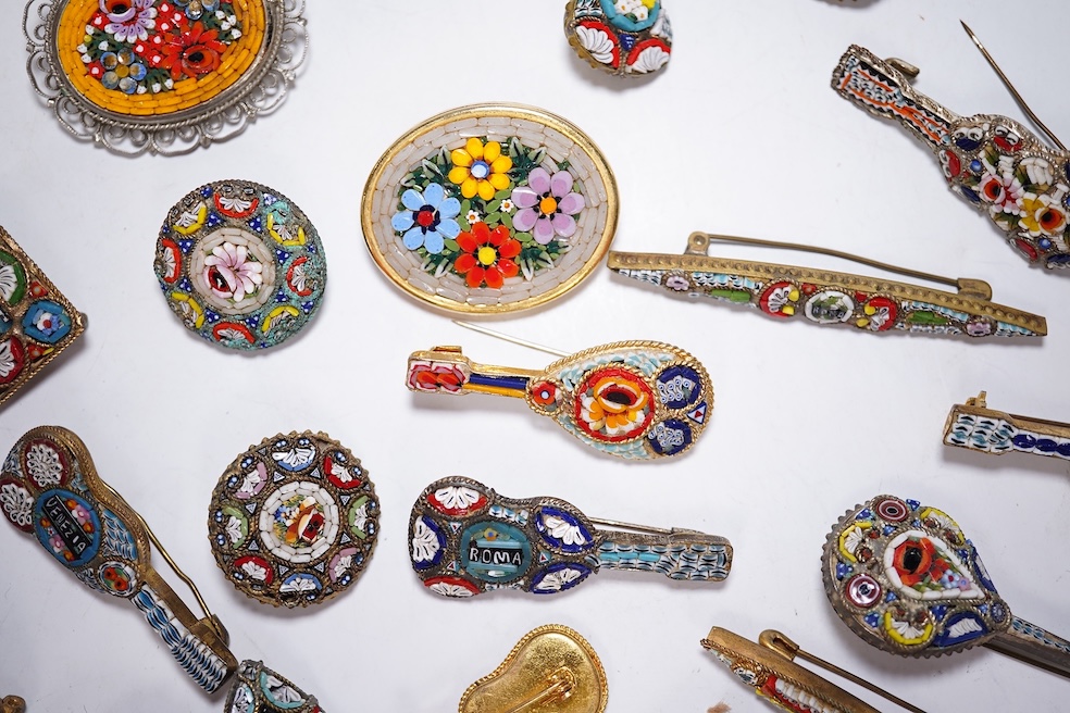 A collection of twenty-eight micro-mosaic brooches, including ten banjo and guitars shaped brooches, six similar large oval brooches, nine small brooches and three long brooches. (28) Condition - good